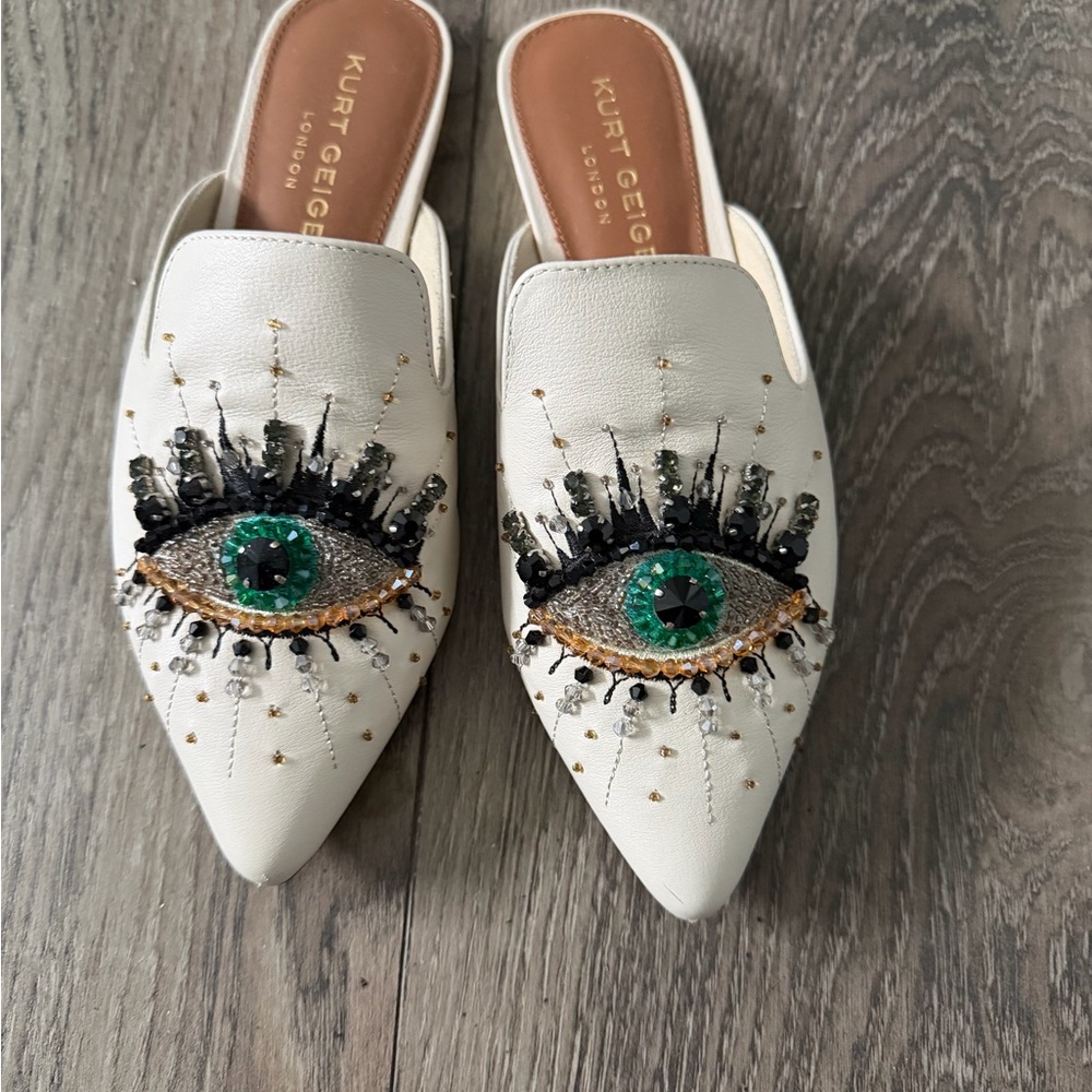 Kurt Geiger White Mules with Green Eye Embellishment